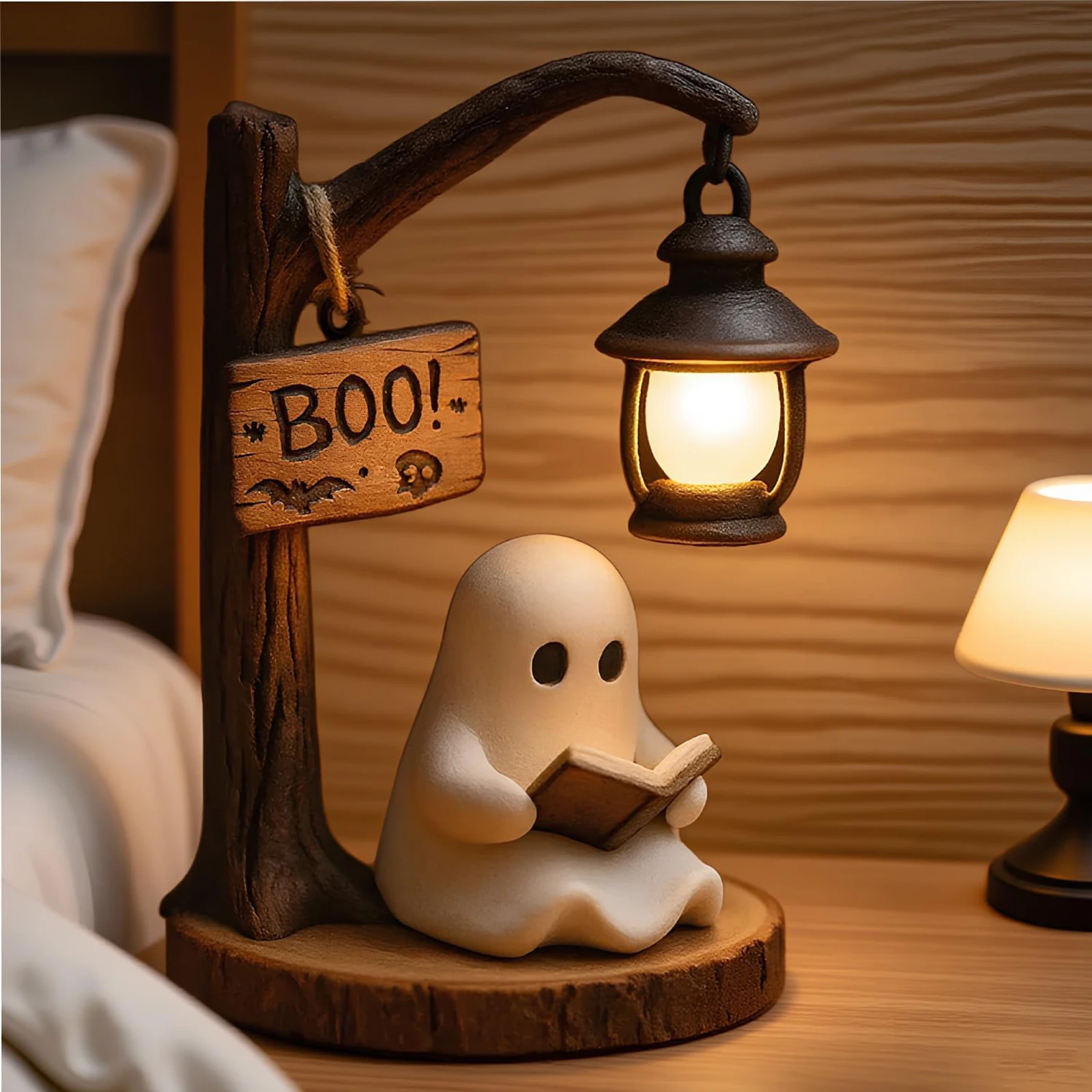 Ghost reading beside a lantern